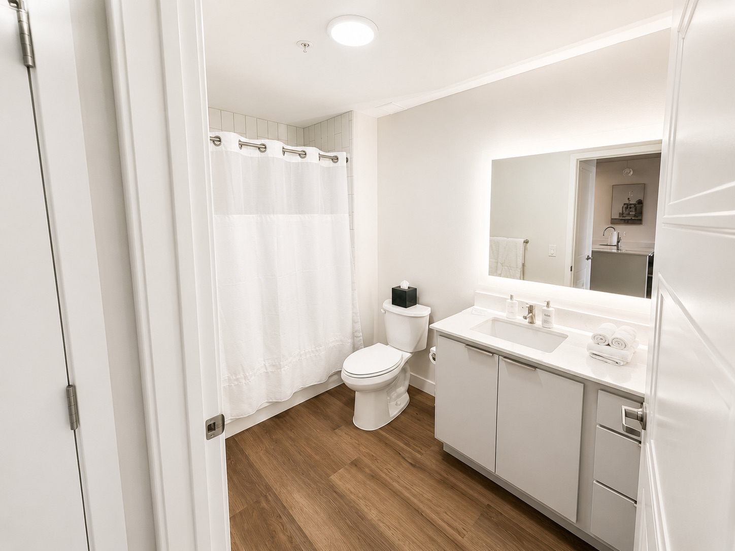 Spacious bathrooms with everything you need a bathroom with a tub, sink and toilet