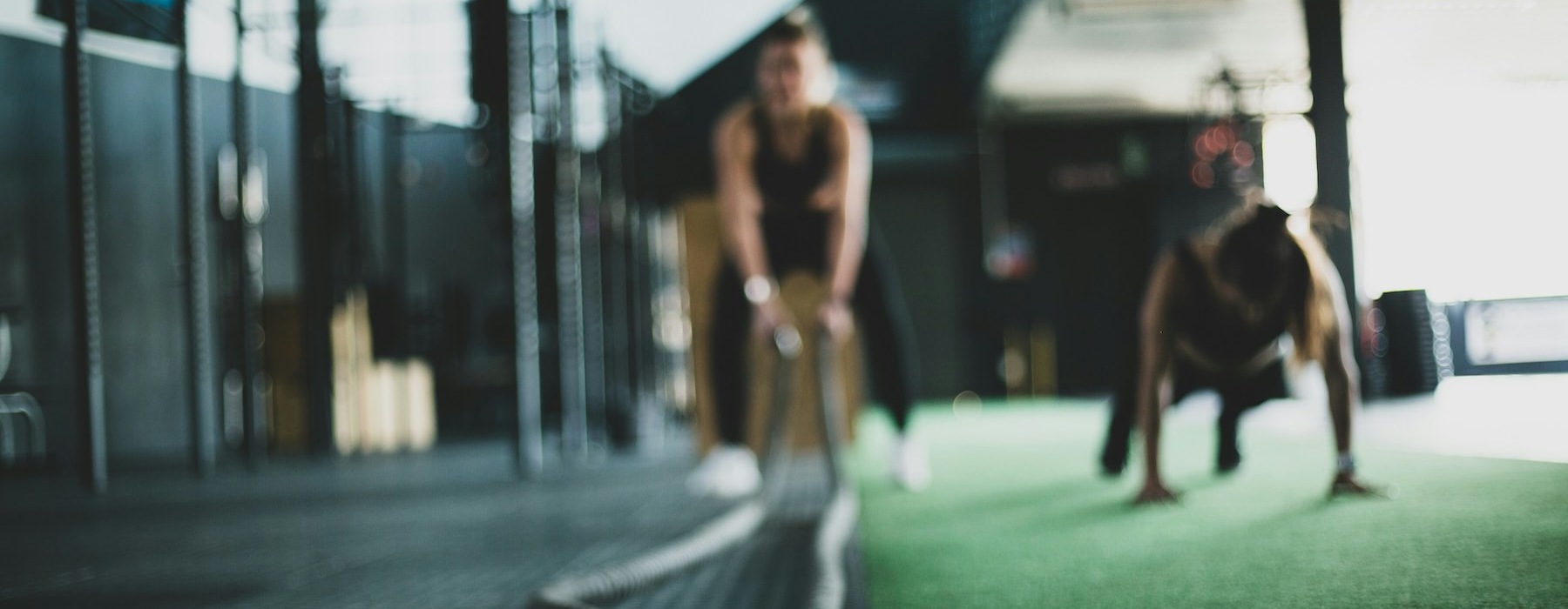 two people working out in a gym