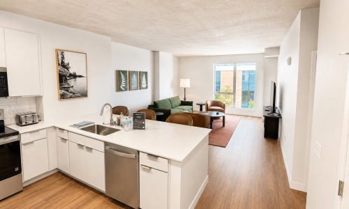 a kitchen with white counters